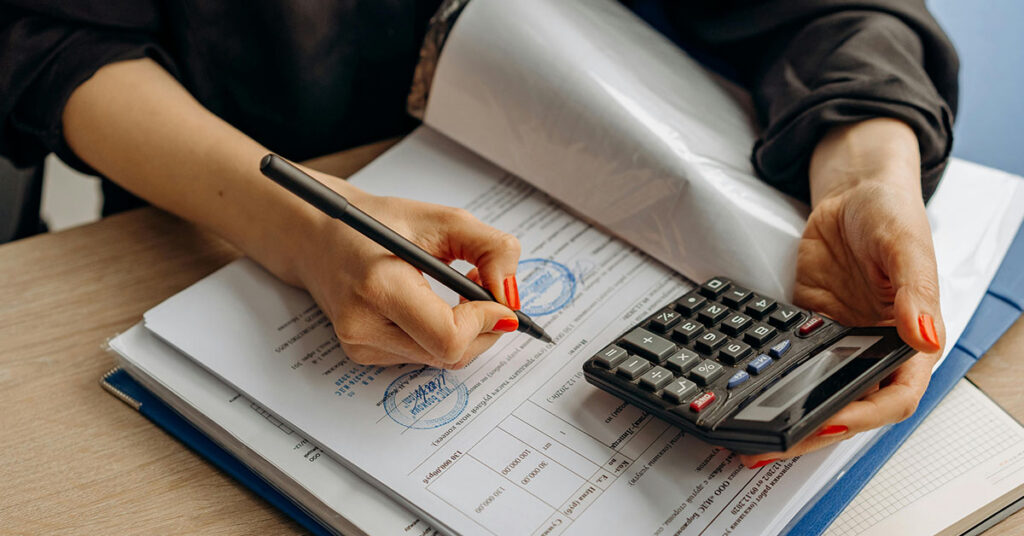 Sanctions screening audit process in South Africa – professional reviewing compliance documents for SARB and Prudential Authority audits.